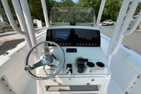 2023 Sportsman Open 232 Center Console boat dashboard with steering wheel and controls.