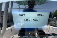 Display screen on 2023 Sportsman Open 232 Center Console showing trip data and fuel usage.