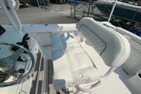 2023 Sportsman Open 232 Center Console boat interior with white cushioned seating.