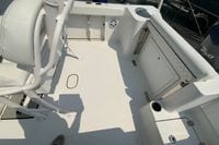 2023 Sportsman Open 232 Center Console boat interior with seating and storage compartments.