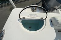 2023 Sportsman Open 232 Center Console livewell with open lid, showcasing interior.