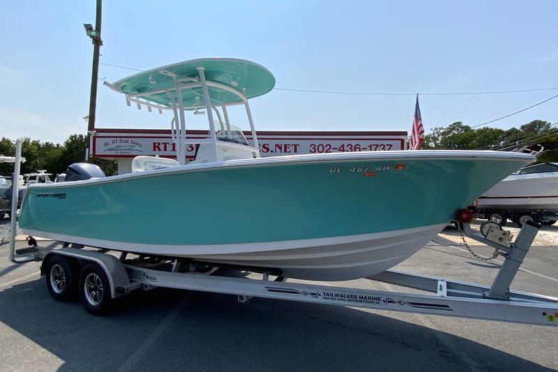 2023 Sportsman Open 232 Center Console boat on trailer at dealership.