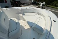 2023 Sportsman Open 232 Center Console boat interior with white cushioned seating.
