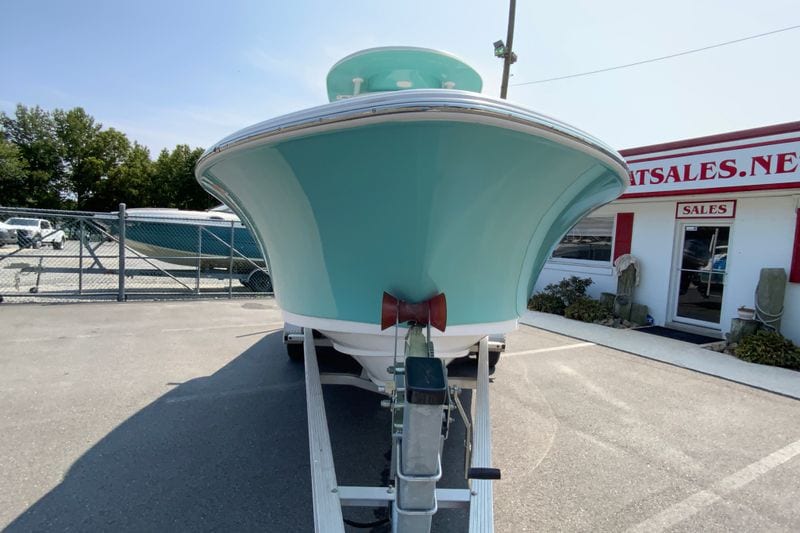 2023 Sportsman Open 232 Center Console boat on trailer at dealership.