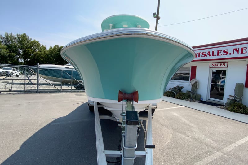 2023 Sportsman Open 232 Center Console boat on trailer at dealership.