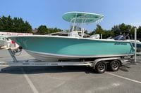 2023 Sportsman Open 232 Center Console boat on trailer at dealership.