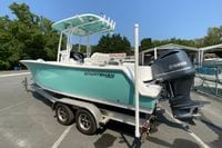 2023 Sportsman Open 232 Center Console boat on trailer with Yamaha engine.