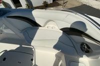 2010 Hurricane SunDeck Sport 200 OB boat interior with seating and speaker.