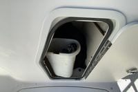 Storage compartment on a 2010 Hurricane SunDeck Sport 200 OB boat.