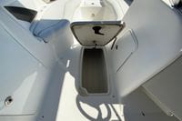 Open storage compartment on 2010 Hurricane SunDeck Sport 200 OB boat interior.