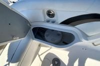 Interior view of a 2010 Hurricane SunDeck Sport 200 OB boat, featuring storage compartment.