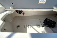 Open storage compartment in 2010 Hurricane SunDeck Sport 200 OB boat.