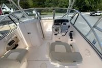 2011 Grady-White Freedom 255 boat interior with steering wheel and seating.