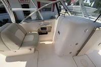 Interior of 2011 Grady-White Freedom 255 boat with seating and storage compartments.