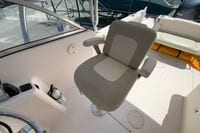 Captain's chair on 2011 Grady-White Freedom 255 boat, featuring a comfortable design.