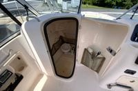 Interior view of a 2011 Grady-White Freedom 255 boat's compact bathroom area.