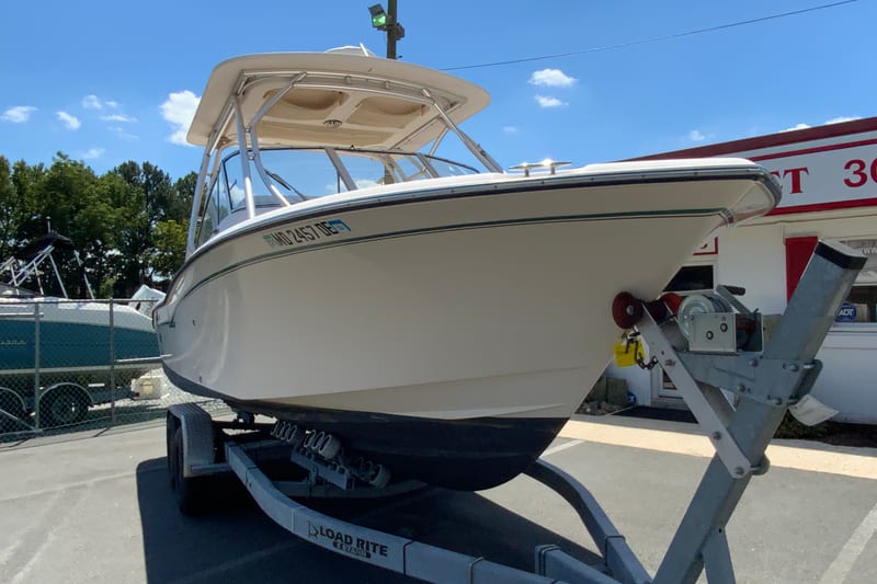 2011 Grady-White Freedom 255 boat on trailer under clear blue sky.