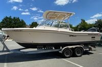 2011 Grady-White Freedom 255 boat on trailer under clear blue sky.