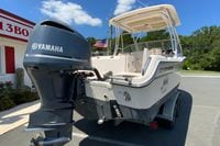 2011 Grady-White Freedom 255 boat with Yamaha outboard motor in a parking lot.