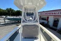 2025 Pathfinder 2600 TRS boat at dealership, showcasing helm and seating area.