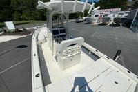 2025 Pathfinder 2600 TRS boat at dealership, showcasing helm and seating area.