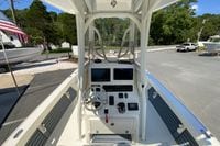 2025 Pathfinder 2600 TRS boat cockpit with steering wheel and navigation controls.