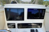Control panel of 2025 Pathfinder 2600 TRS boat with Garmin and Humminbird displays.