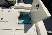 Open storage compartment on 2025 Pathfinder 2600 TRS boat, showcasing interior details.