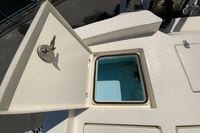 Open storage compartment on 2025 Pathfinder 2600 TRS boat, showcasing interior space.