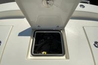 Open hatch on 2025 Pathfinder 2600 TRS boat deck, revealing storage compartment.