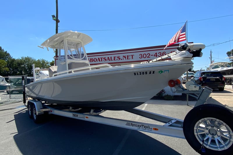2025 Pathfinder 2600 TRS boat on trailer, displayed outdoors with American flag.