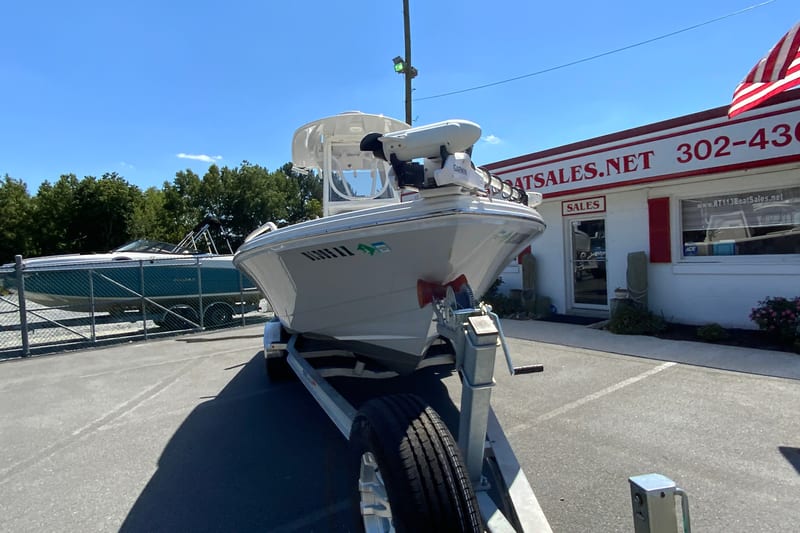 2025 Pathfinder 2600 TRS boat on trailer at dealership, sunny day.