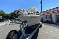 2025 Pathfinder 2600 TRS boat on trailer at dealership, featuring Garmin equipment.