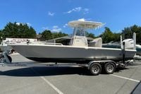 2025 Pathfinder 2600 TRS boat on trailer under clear blue sky.