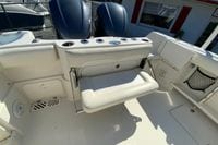 2014 Sailfish 290 CC boat interior with foldable seat and storage compartments.