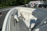 2014 Sailfish 290 CC boat interior with seating, displayed at a boat sales lot.