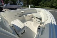 2014 Sailfish 290 CC boat interior with white seating and stainless steel accents.