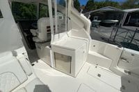 2027 Pursuit D 326 Denali boat interior with seating and storage compartments.