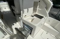 2027 Pursuit D 326 Denali boat interior with open storage and sink.