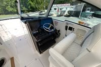 Interior of 2027 Pursuit D 326 Denali boat with modern helm and plush seating.