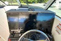Helm of 2027 Pursuit D 326 Denali boat with dual Garmin displays and steering wheel.