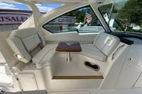 Interior of 2027 Pursuit D 326 Denali boat with seating and table.