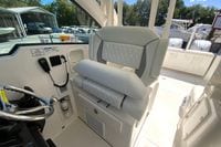 2027 Pursuit D 326 Denali boat interior with luxurious seating and steering wheel.