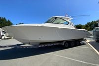 2027 Pursuit D 326 Denali boat on trailer in sunny outdoor setting.