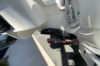 Rear view of 2027 Pursuit D 326 Denali boat on trailer, showing hull details.
