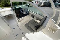 2024 Pursuit DC 246 Dual Console boat interior with helm and seating area.