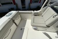 2024 Pursuit DC 246 Dual Console boat interior with cushioned seating and storage compartments.