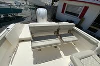 2024 Pursuit DC 246 Dual Console boat interior with cushioned seating and storage compartments.