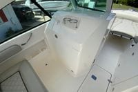 2024 Pursuit DC 246 Dual Console interior with sleek white design and comfortable seating.