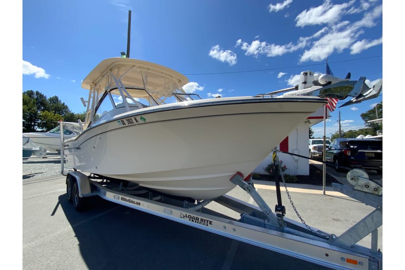 2017 Grady-White Freedom 255 boat on trailer under clear blue sky.